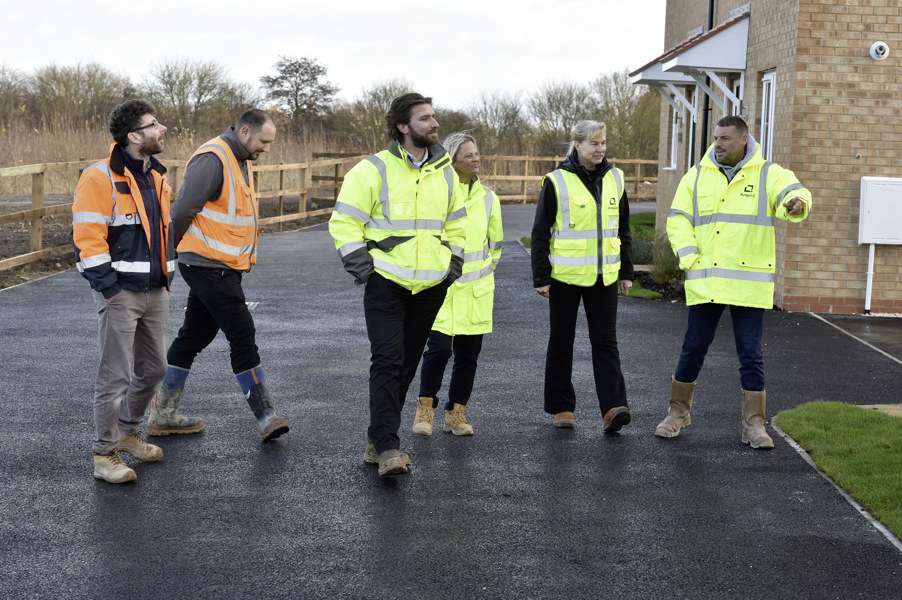 People outside new build homes