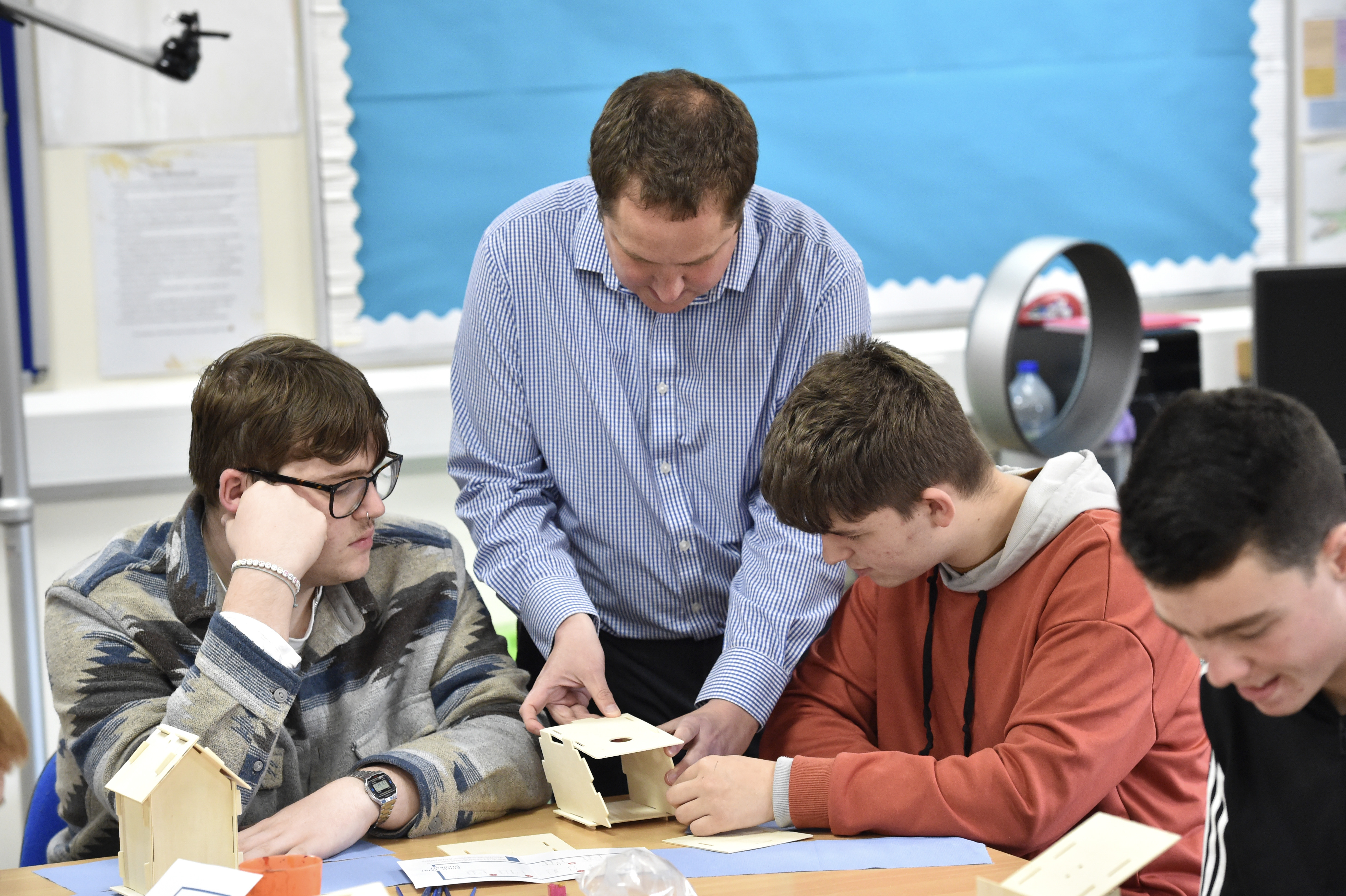 Teacher teaching young men