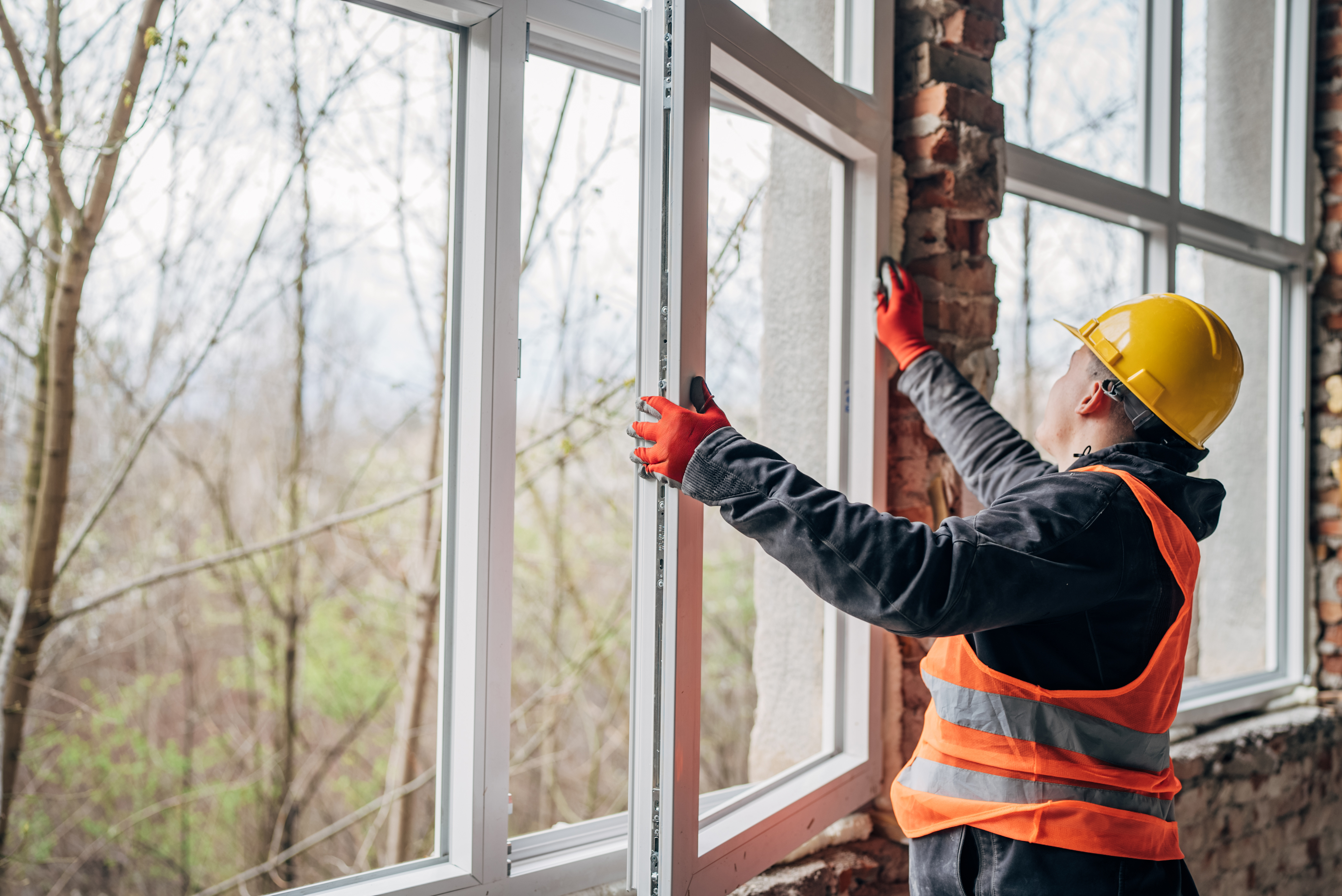 Man fitting new window