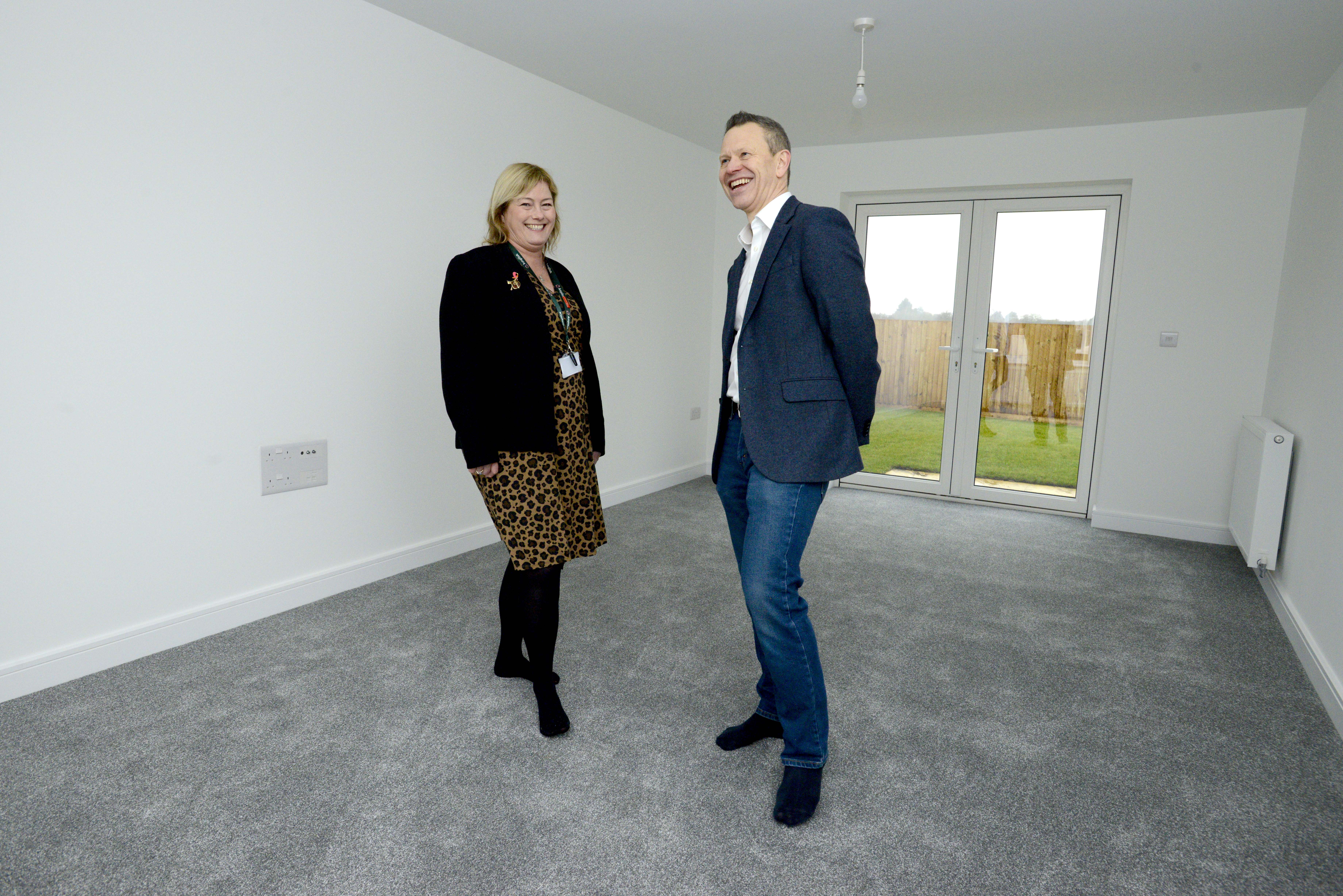 Two people in a new build home