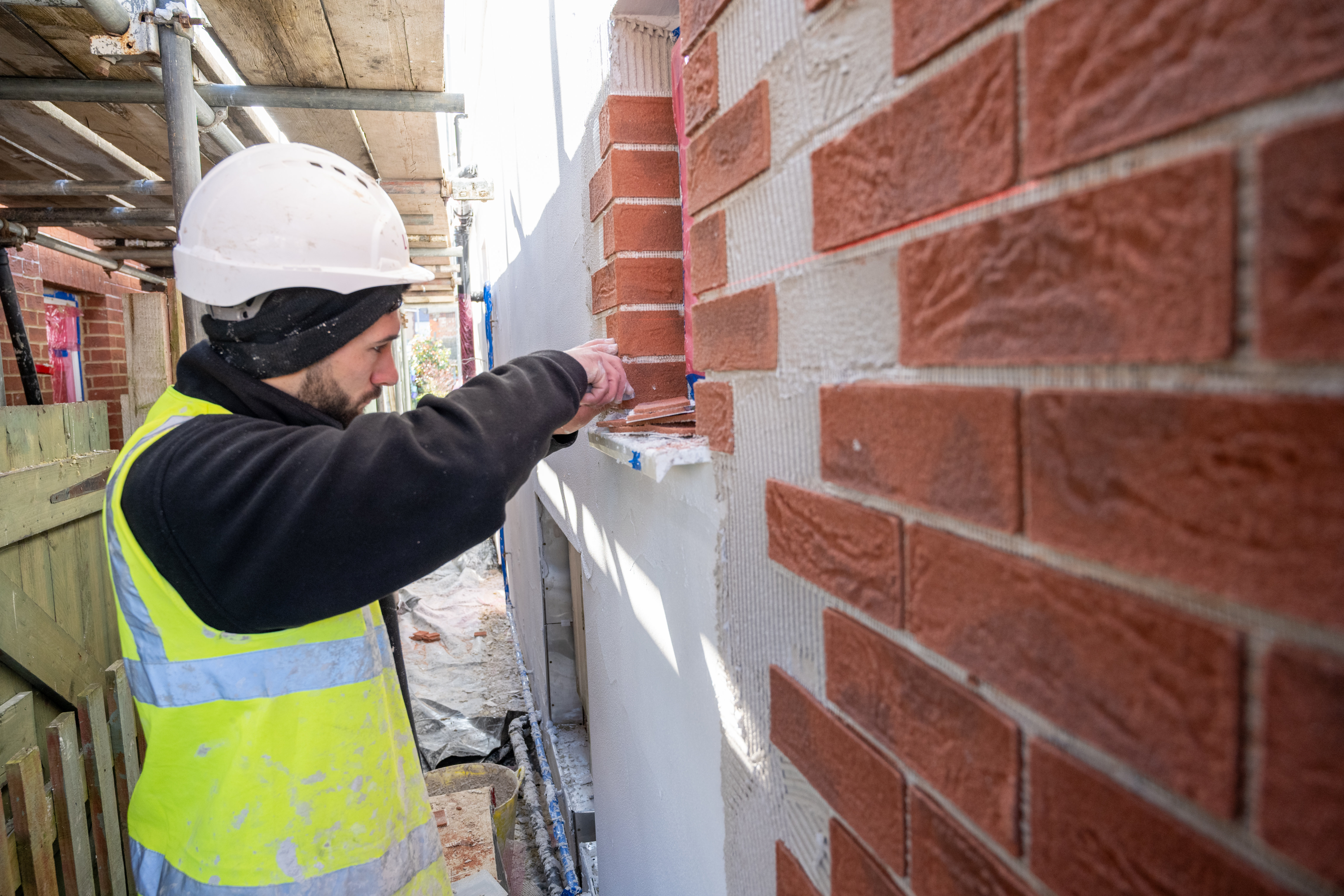 Man laying bricks