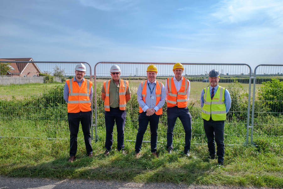 Men standing on new development